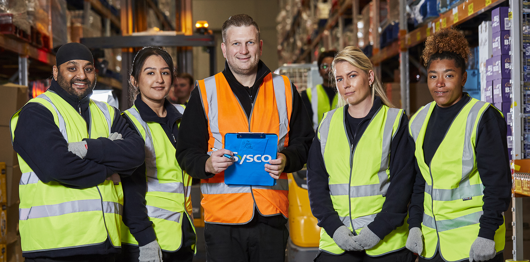 Worker with trolley in warehouse.